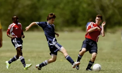 Boys Playing soccer with rules