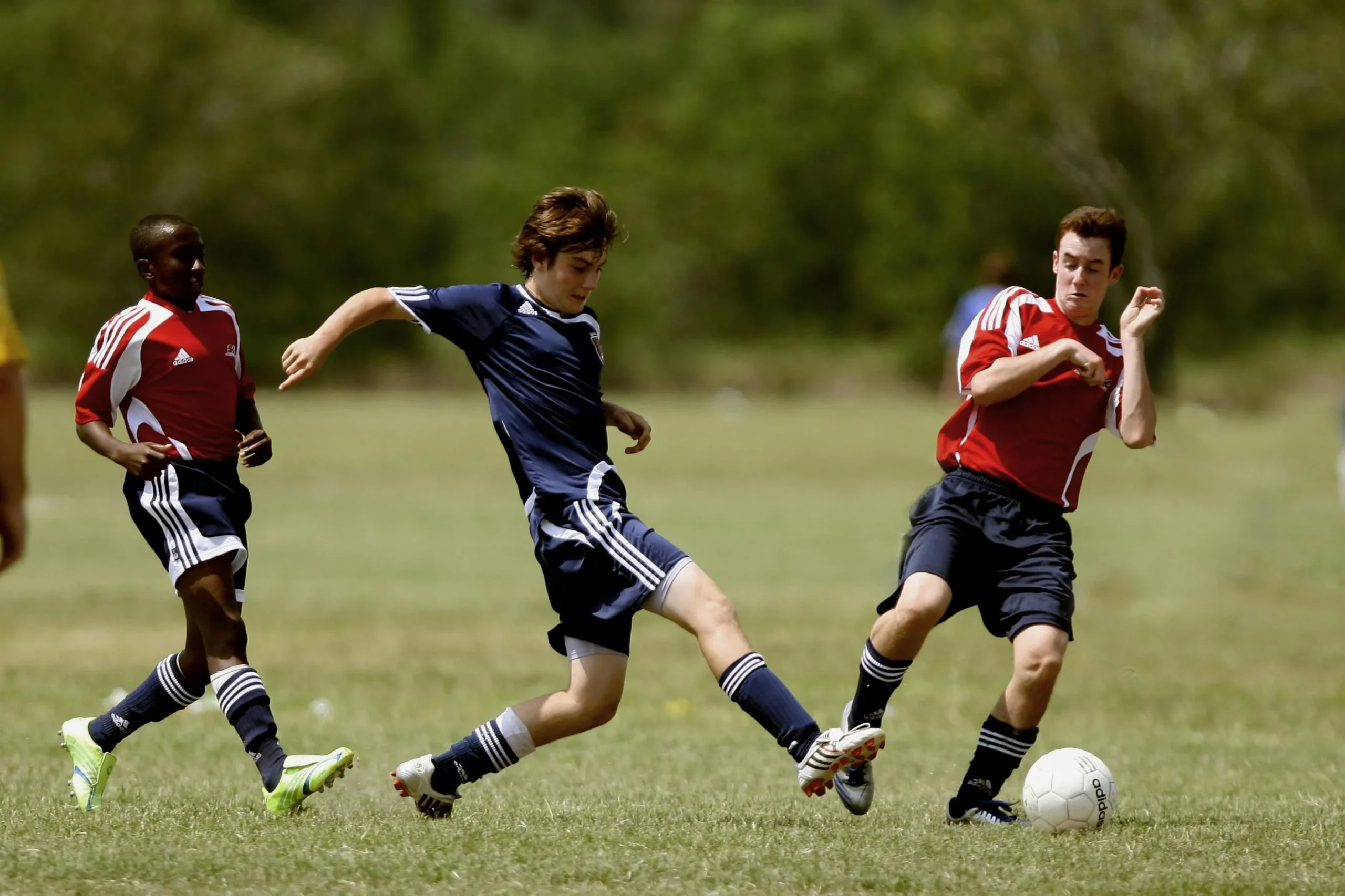 Boys Playing soccer with rules